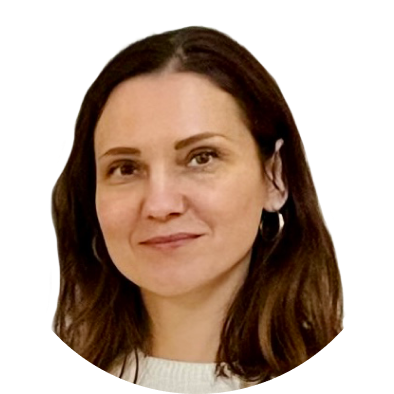 Woman with medium brown hair, neutral expression.