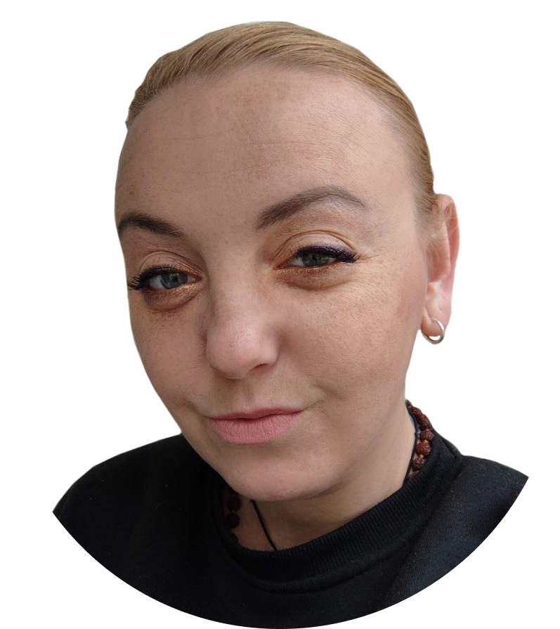 Close-up of a person with light makeup and earrings.